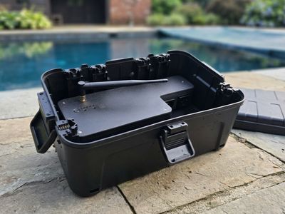 The Pool Guardian controller case open, showing the weatherproof board and WiFi antenna